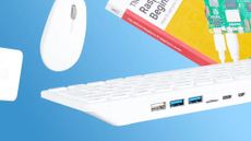 white keyboard PC with mouse and book