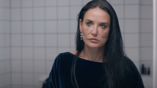 Demi Moore looks into the mirror with tears staining her cheeks 